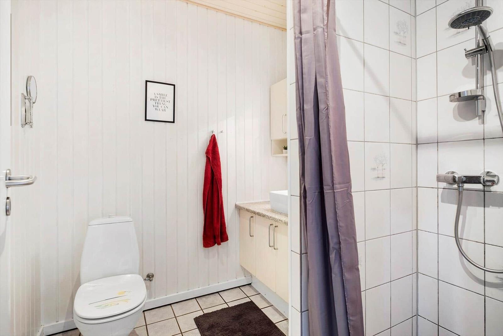 Bathroom with shower, toilet, and sink