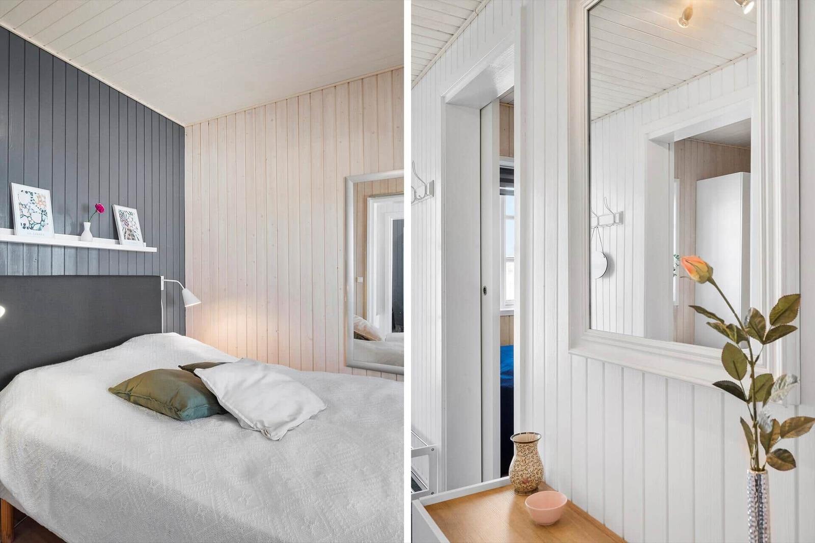 Bedroom with bed, wall cladding, and mirror. Hallway with mirror and vases.