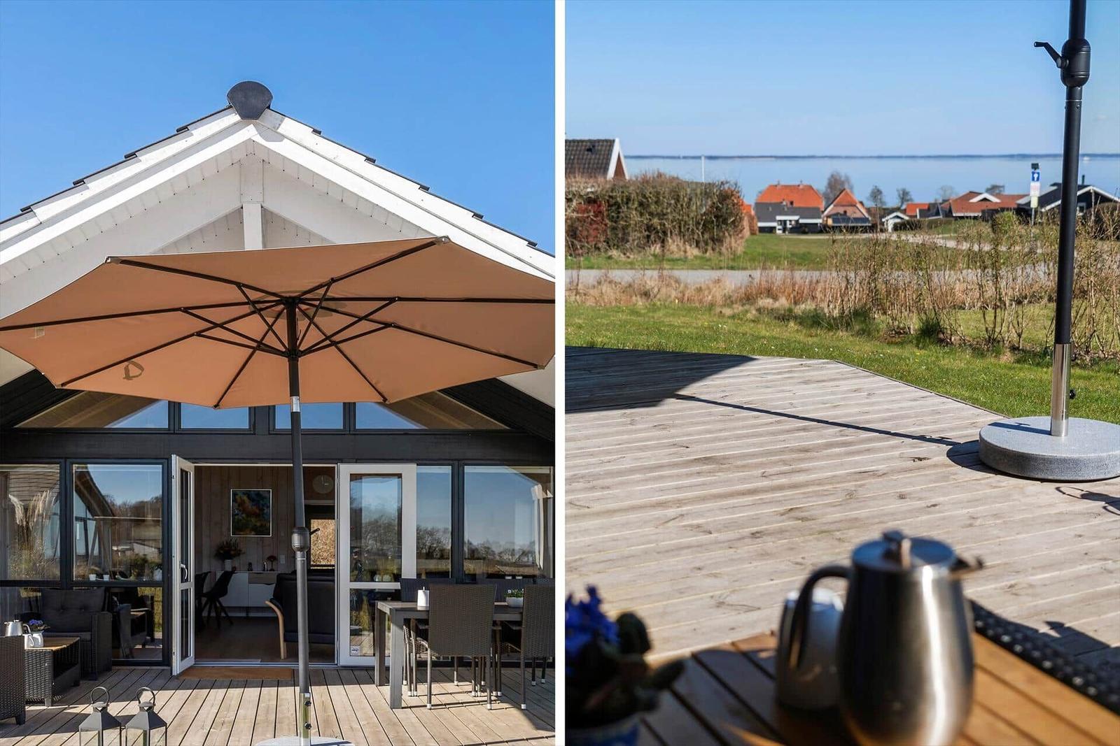 Deck with umbrella and view of the water
