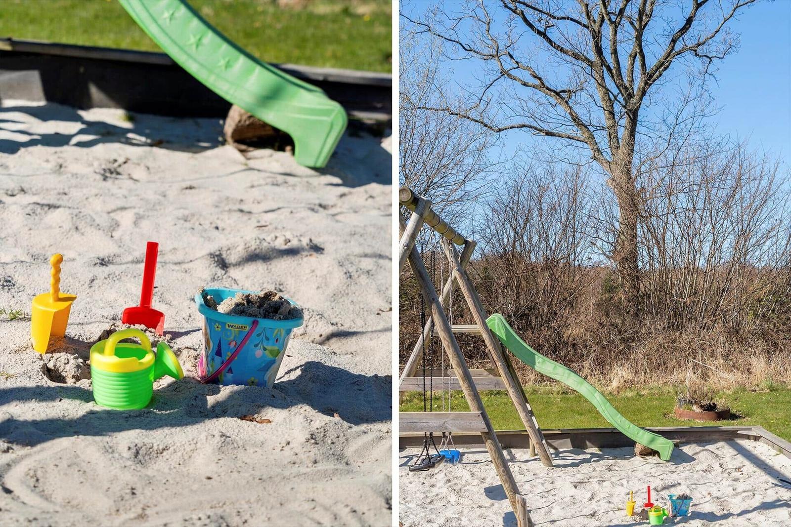 Sandpit with toys and green slide in the garden