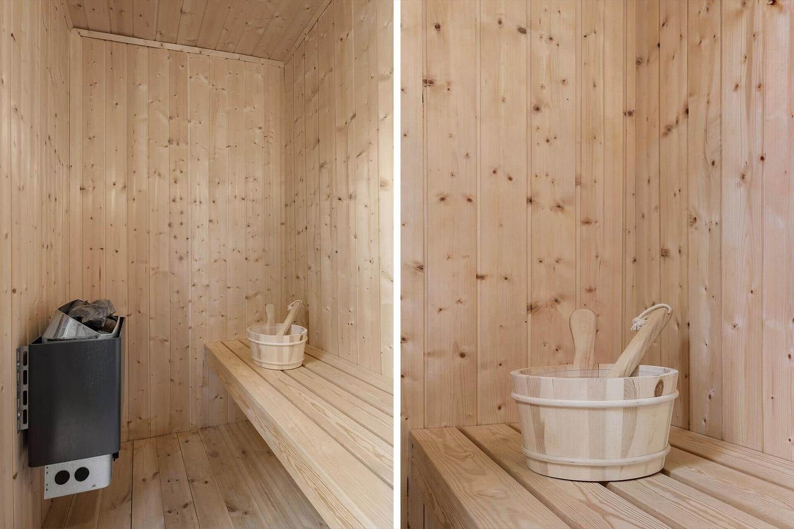 Sauna with wooden walls, bench, and bucket with ladles.