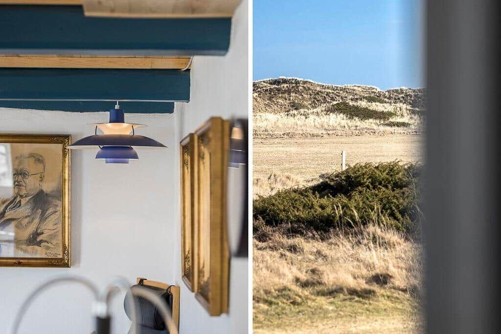 Innenraum mit Deckenbalken und Fensterblick auf Hügel