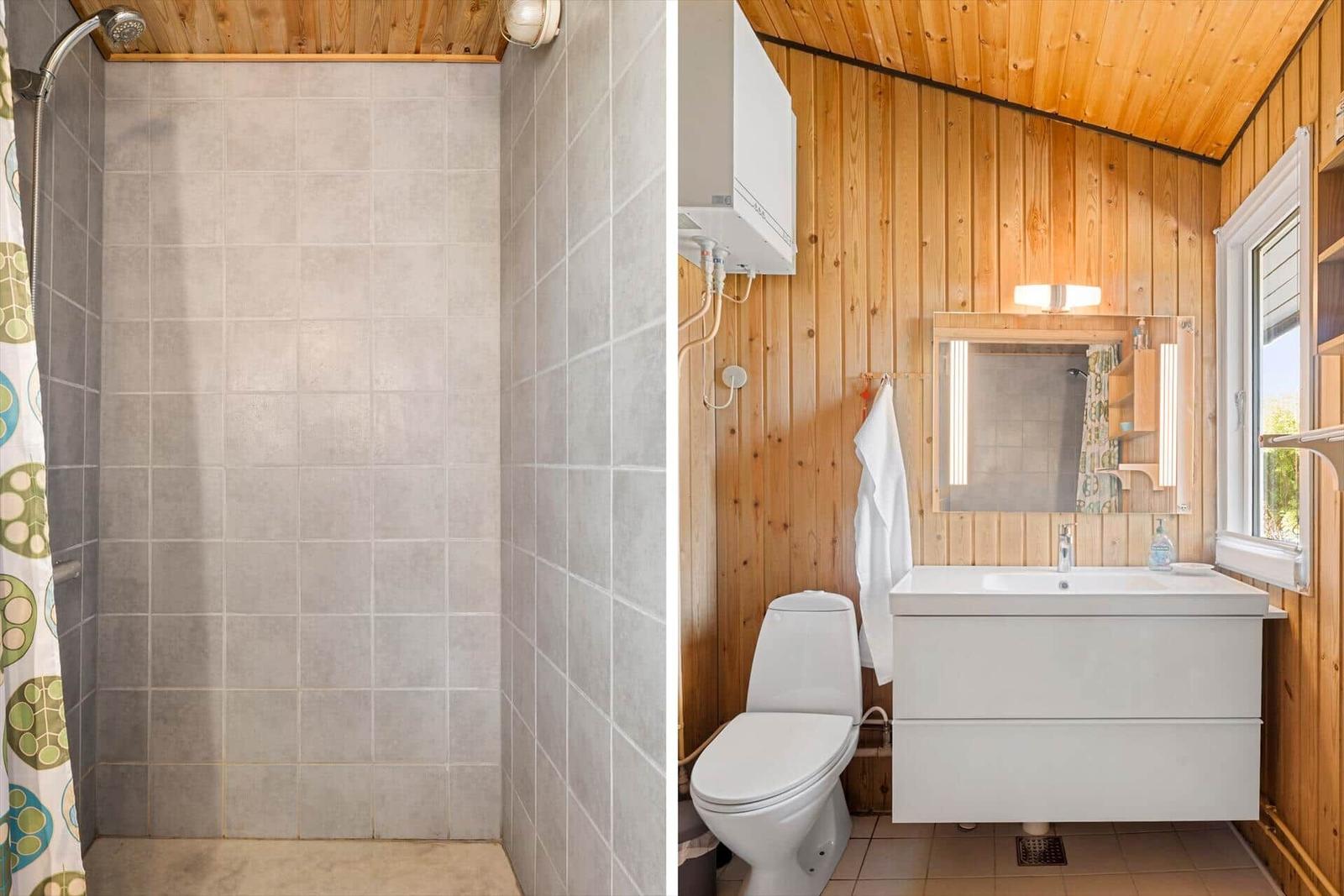 Bad mit Dusche und Waschbecken, Holzwand und Spiegel