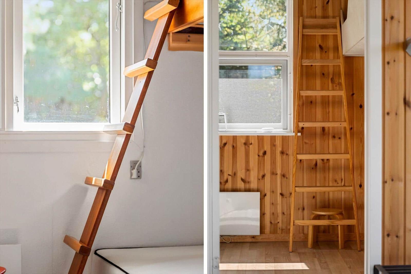 Hölzerner Leiter führt zu einer oberen Ebene mit Fenster und Holzwand.
