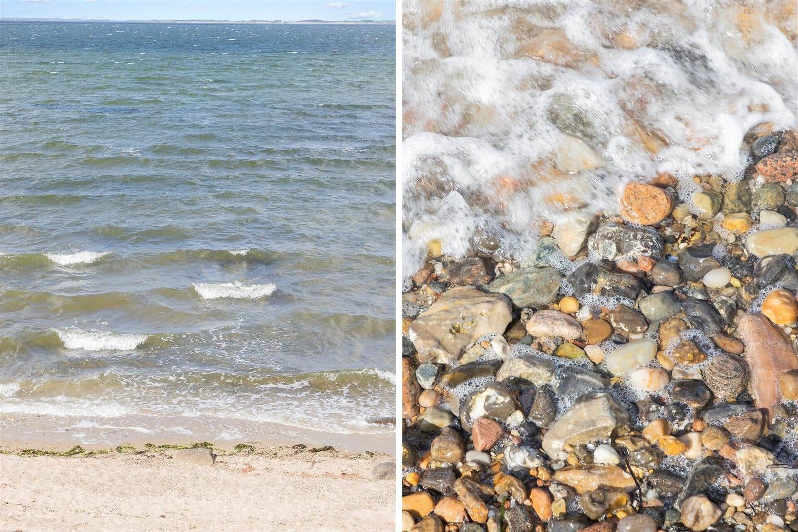 Meeresstrand mit Steinen und Wellen. Blick auf das Wasser und den Uferbereich.