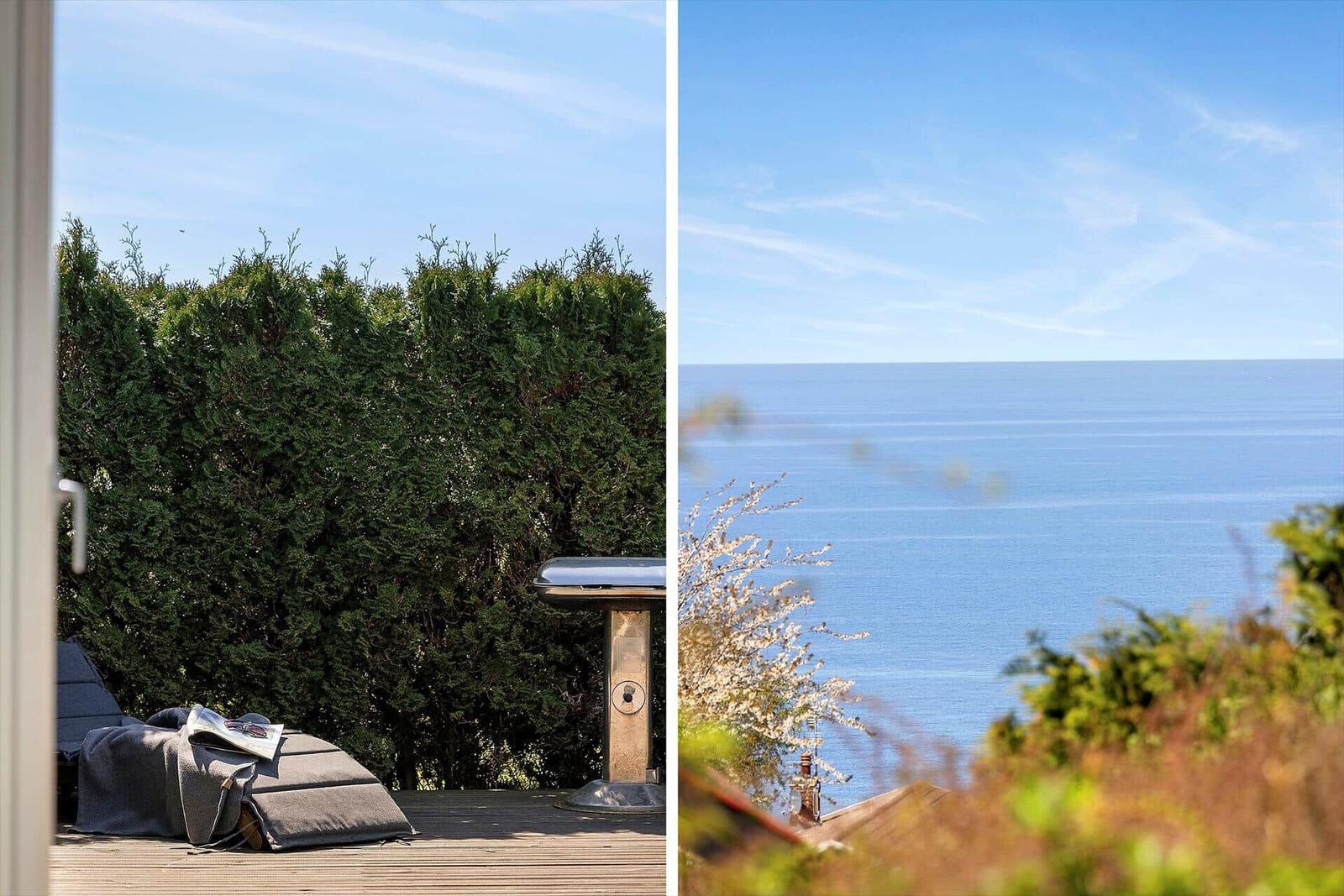 Terrasse mit Liegestuhl und Grill, Blick auf das Meer