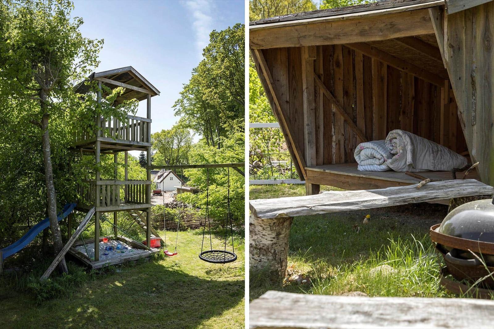 Hinterhof mit Klettergerüst, Schaukel und rustikaler Hütte mit Matratze.
