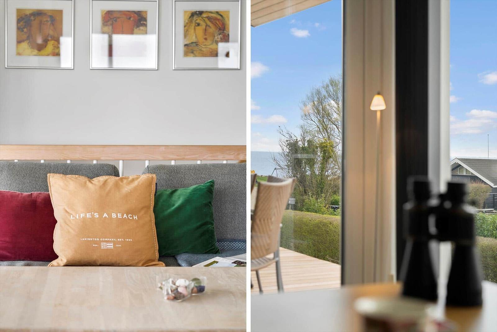 Sofa with cushions and view of the beach