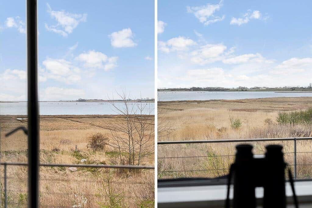 Blick auf einen See mit trockenem Ufer und blauem Himmel.