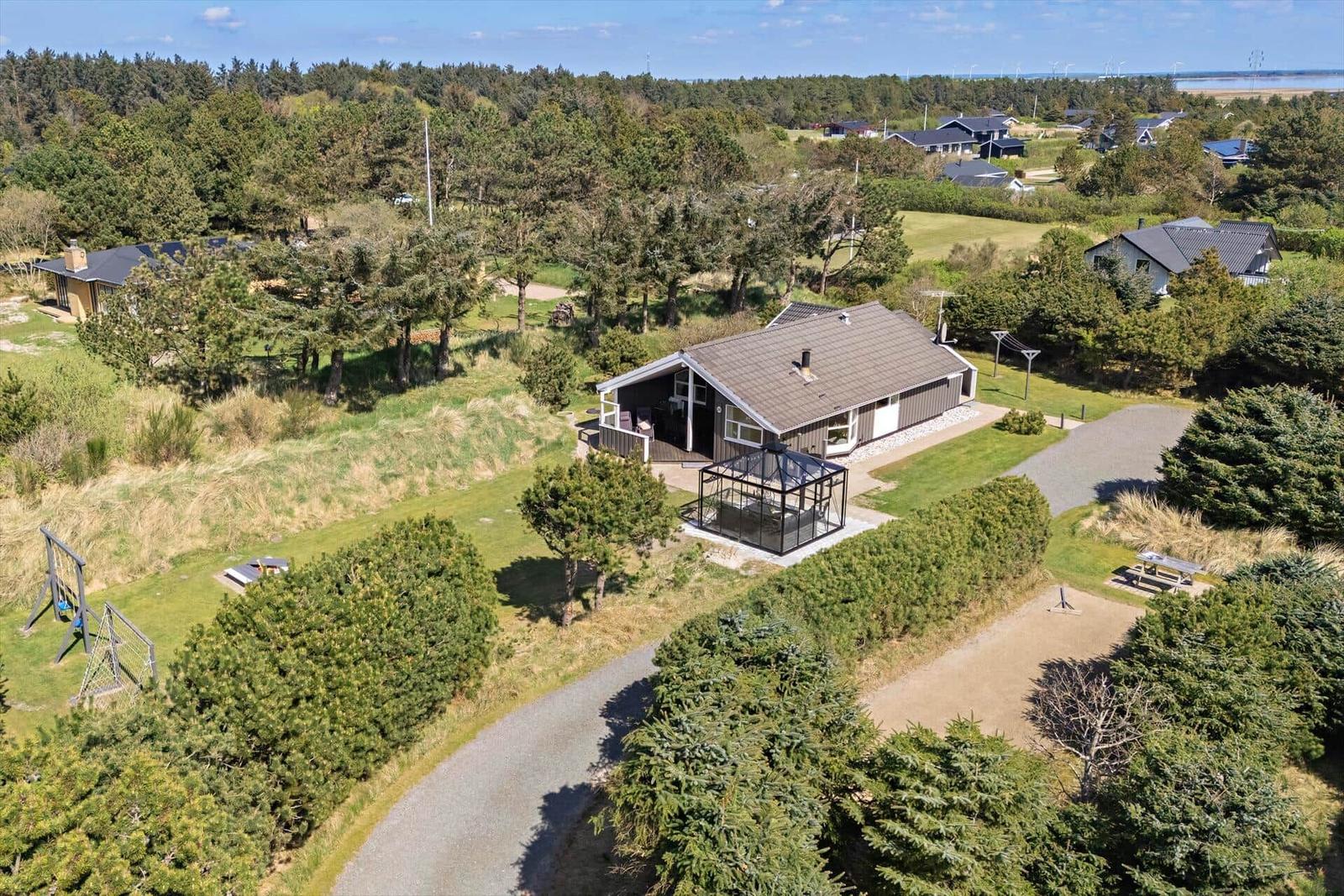 Haus mit Garten, Grillplatz und Blick auf Wald und Strand