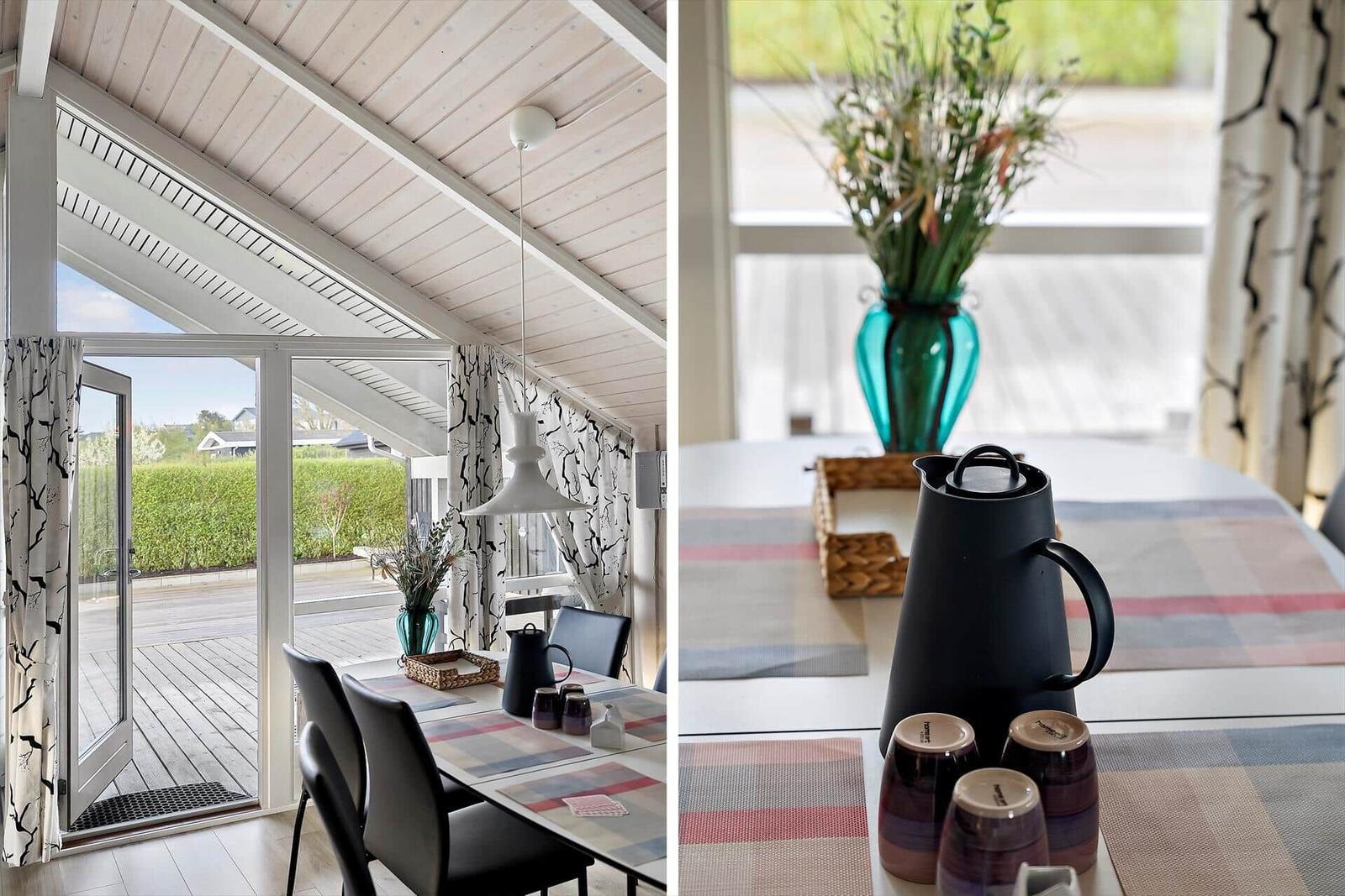 Dining area with table, chairs, and view of terrace