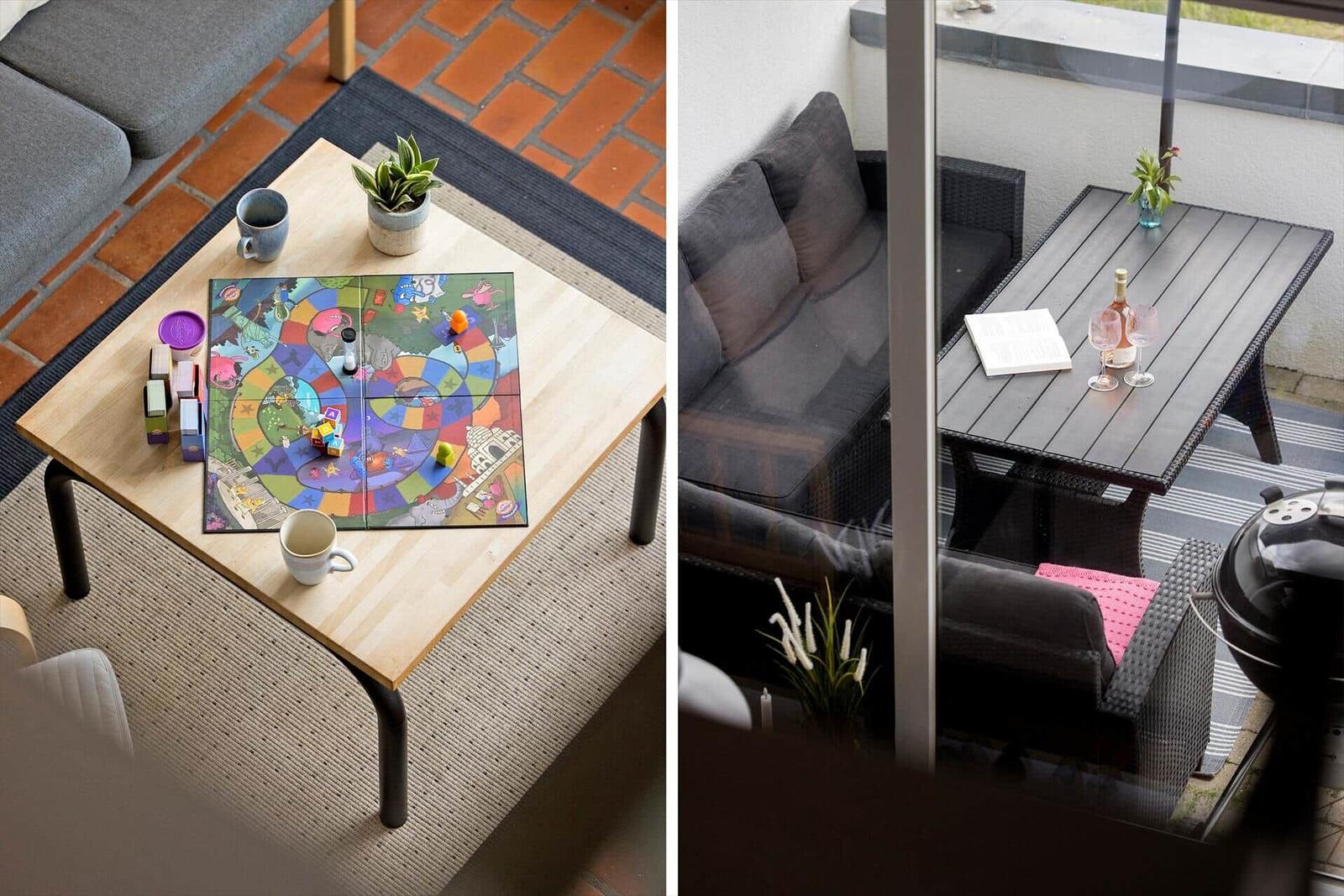 Living area with table and game, terrace with seating and grill.