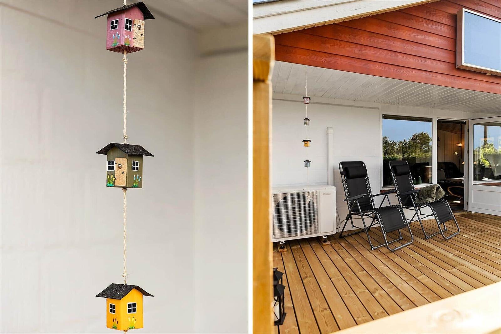 Hanging birdhouses and a terrace with lounge chairs.