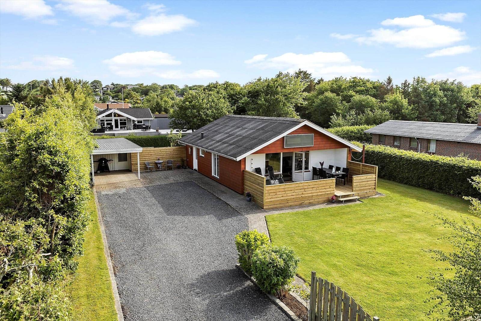 A modern house with wooden terrace and large garden. Grill area and terrace are available.
