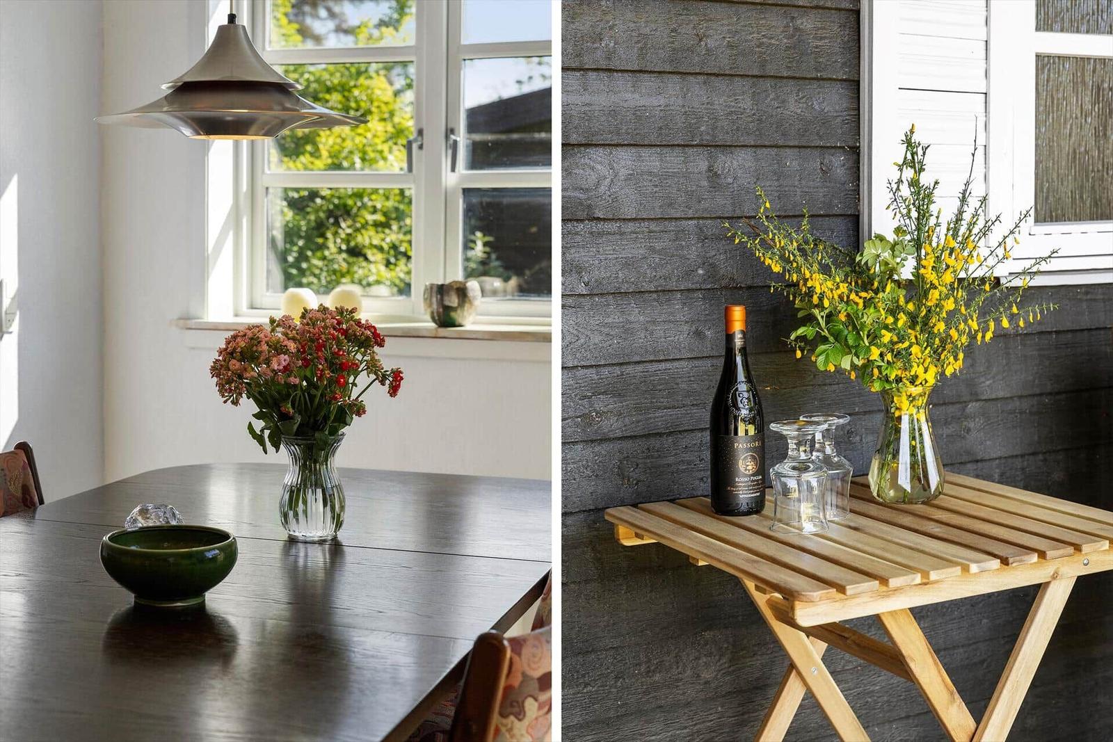 Esszimmer mit Tisch, Blumen und Fenster. Außen: Tisch mit Wein, Gläsern und Blumen.