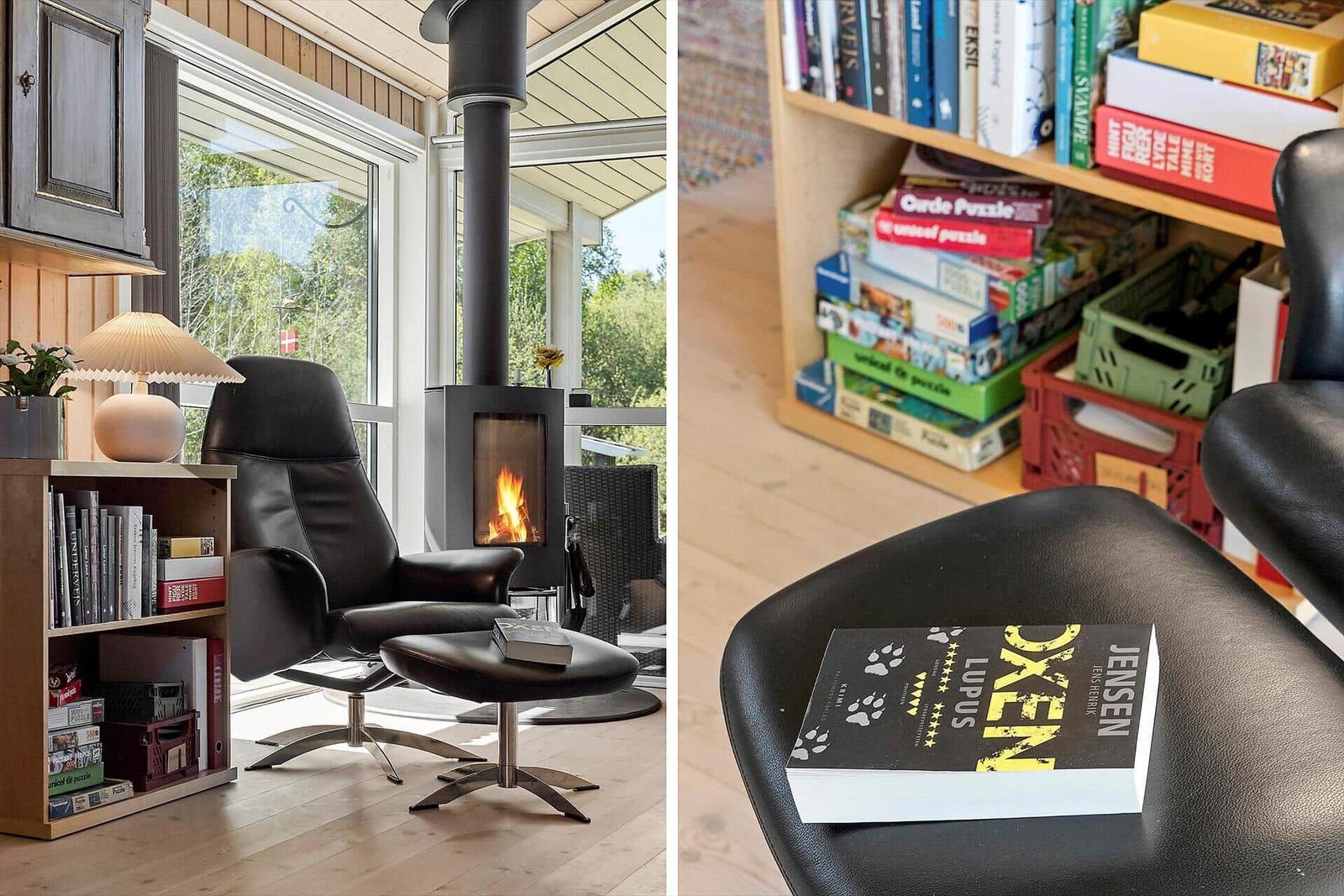 Room with chair, fireplace, and bookshelf. Book rests on seat surface.
