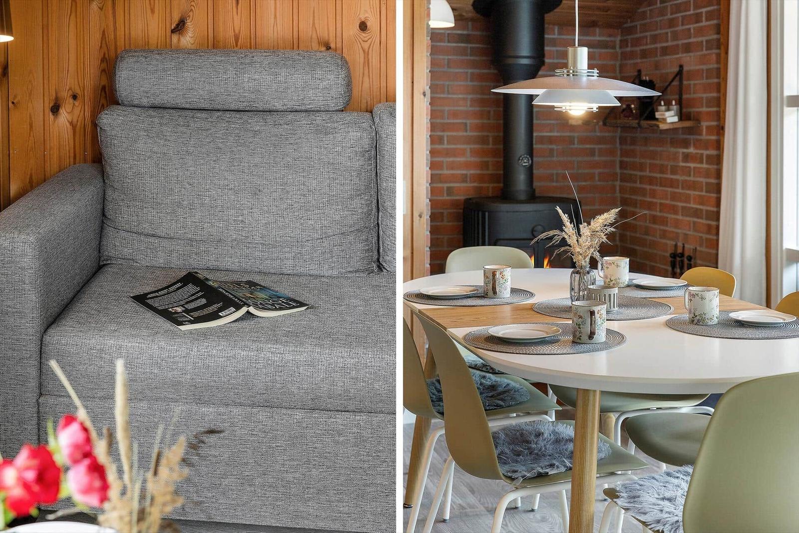 Gray bench with magazine and wood wall. Round table with chairs and fireplace.