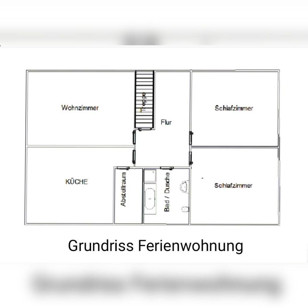 Grundriss zeigt Wohnzimmer, Küche, Schlafzimmer und Bad mit Dusche.