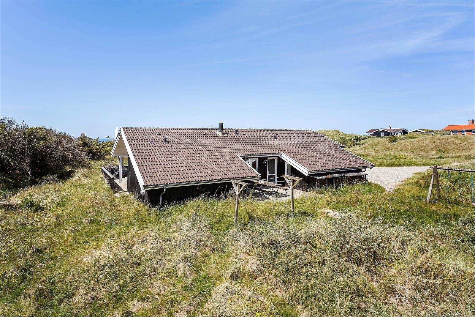 Holzhaus mit Terrasse und Grillplatz auf Dünen