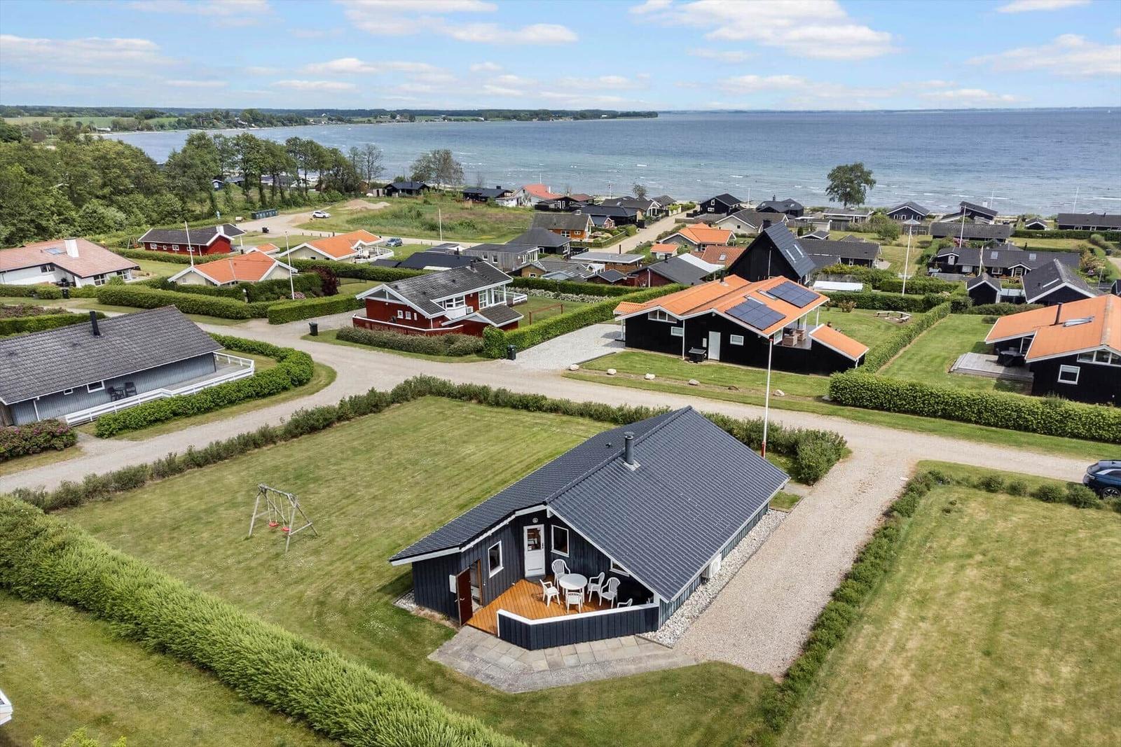 House with terrace and view of the water