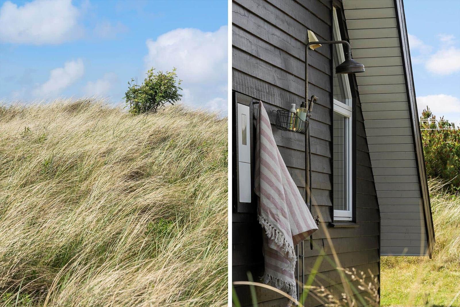 Dünenlandschaft mit Strandhütte und Außen-Dusche