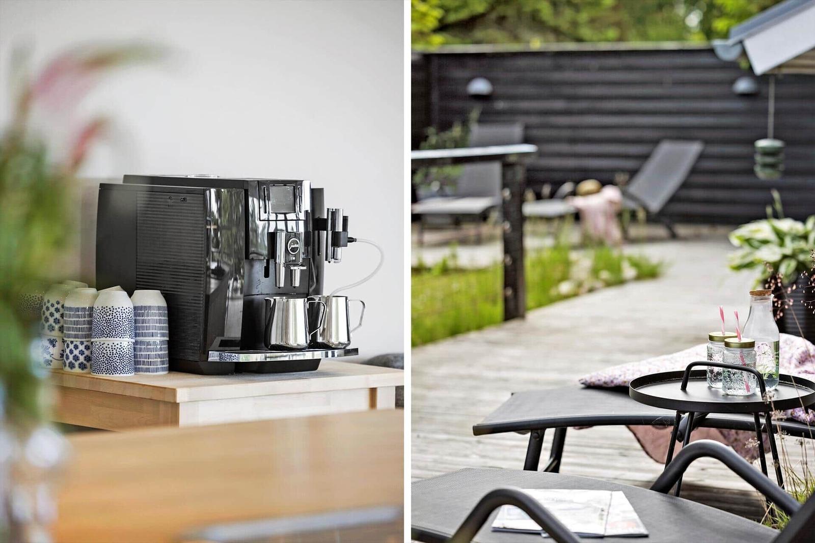 Coffee machine with mugs and terrace with seating and drinks.
