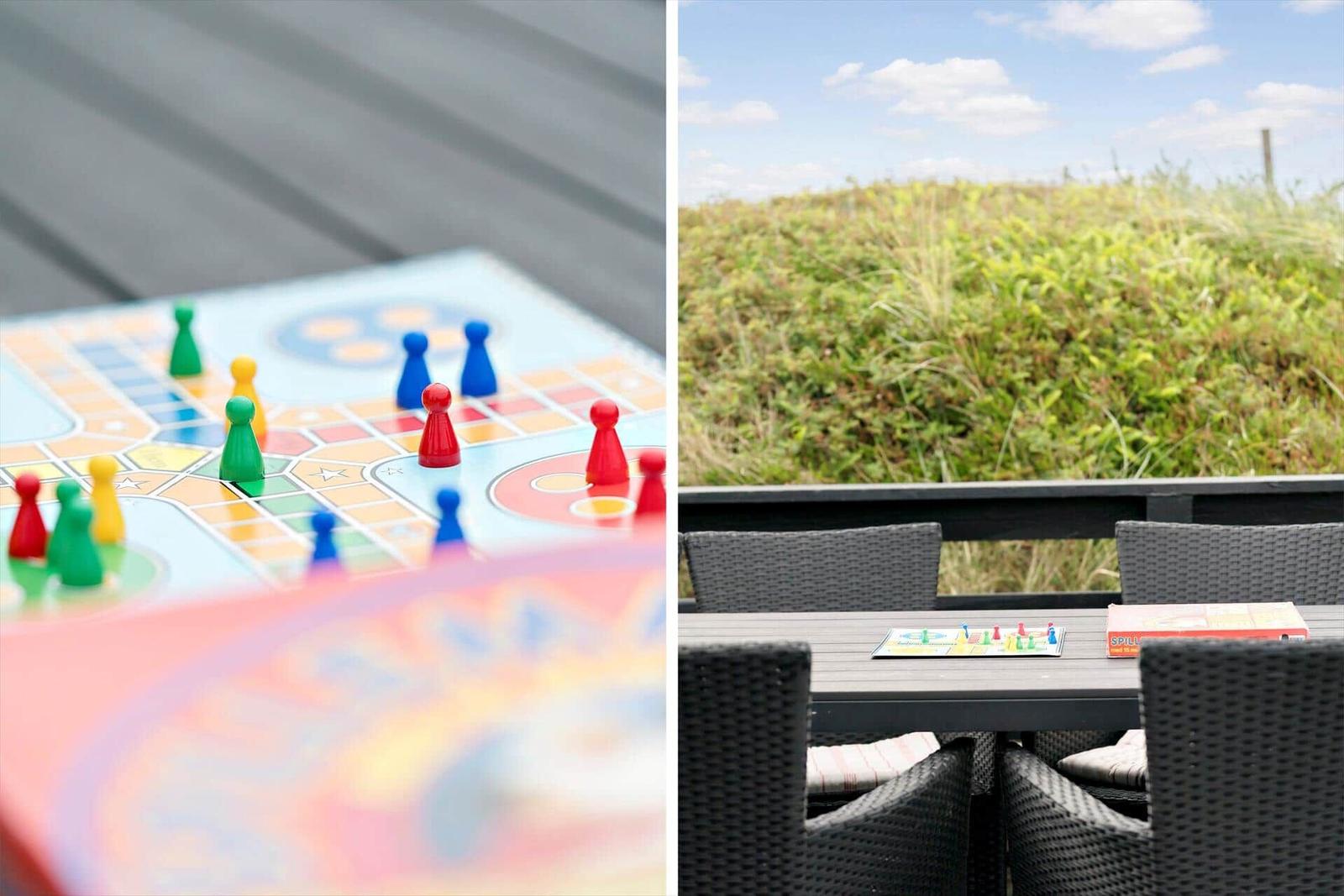 Brettspiel auf Terrasse mit Blick auf Grünflächen