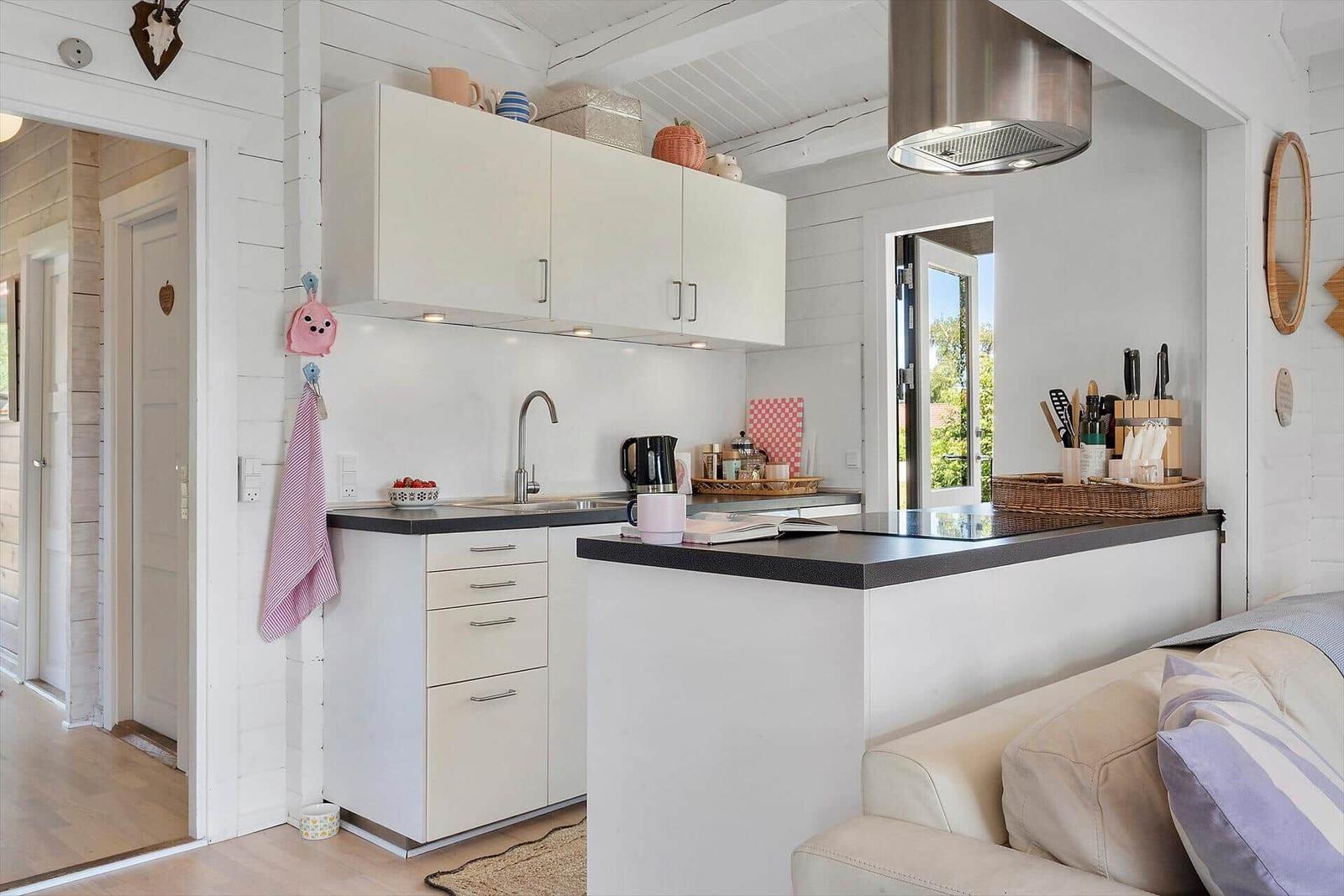 Kitchen with worktop and window to the garden