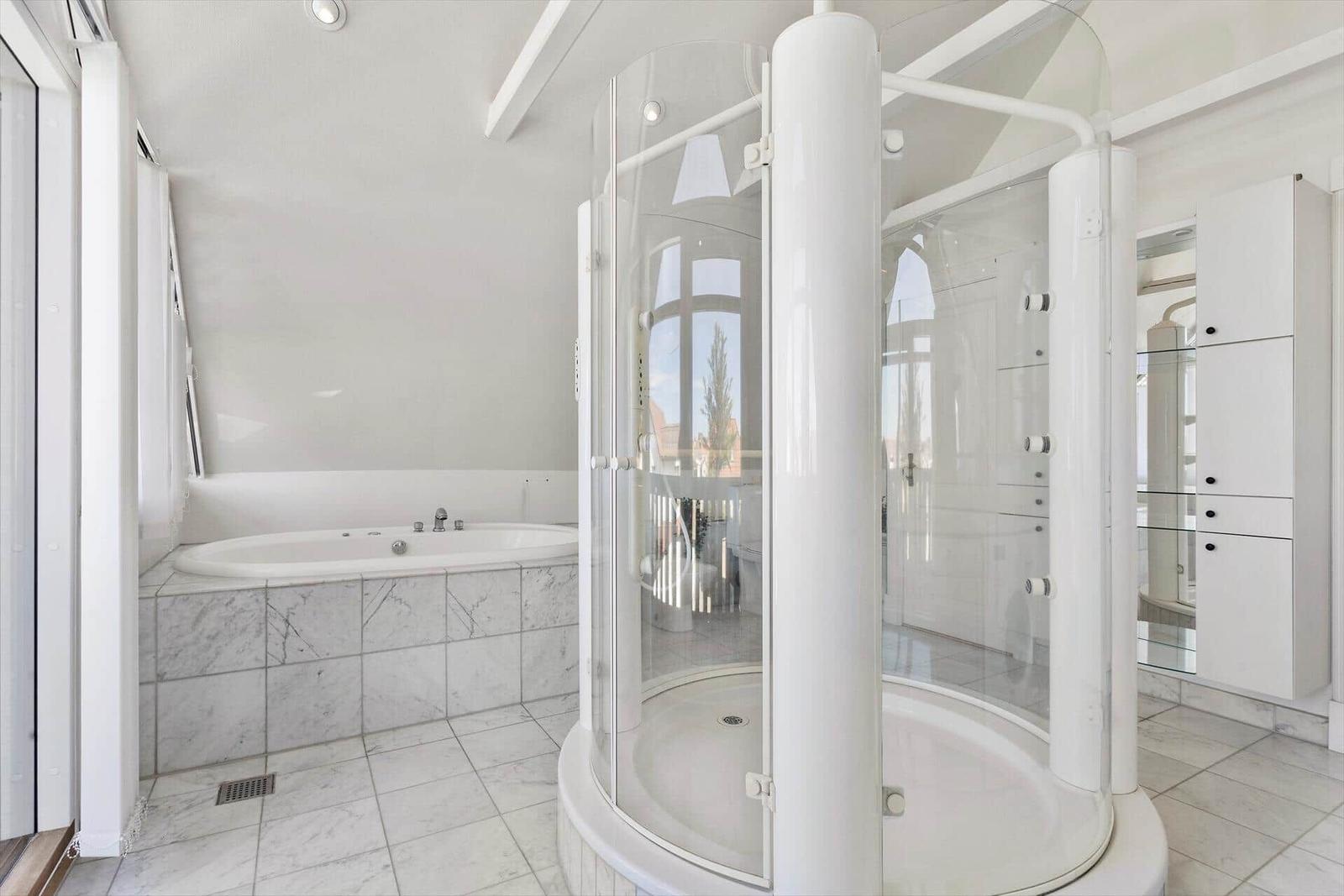 Bathroom with whirlpool and glass shower