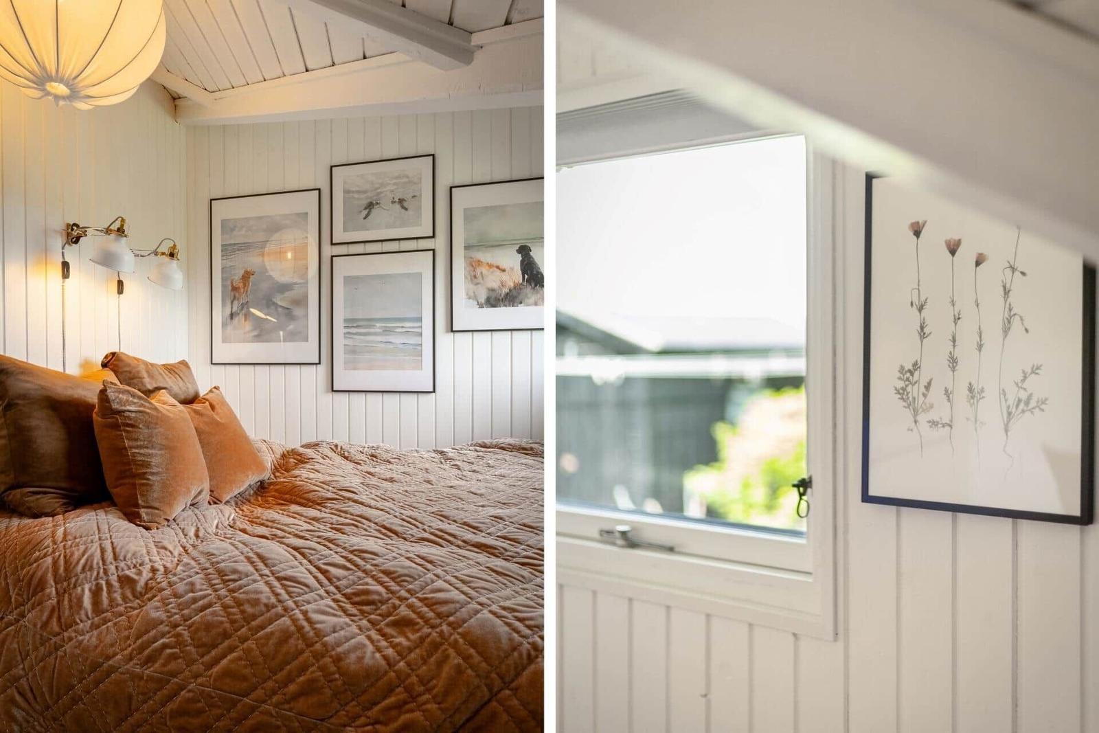 Schlafzimmer mit Bett, Wandbildern und Fenster