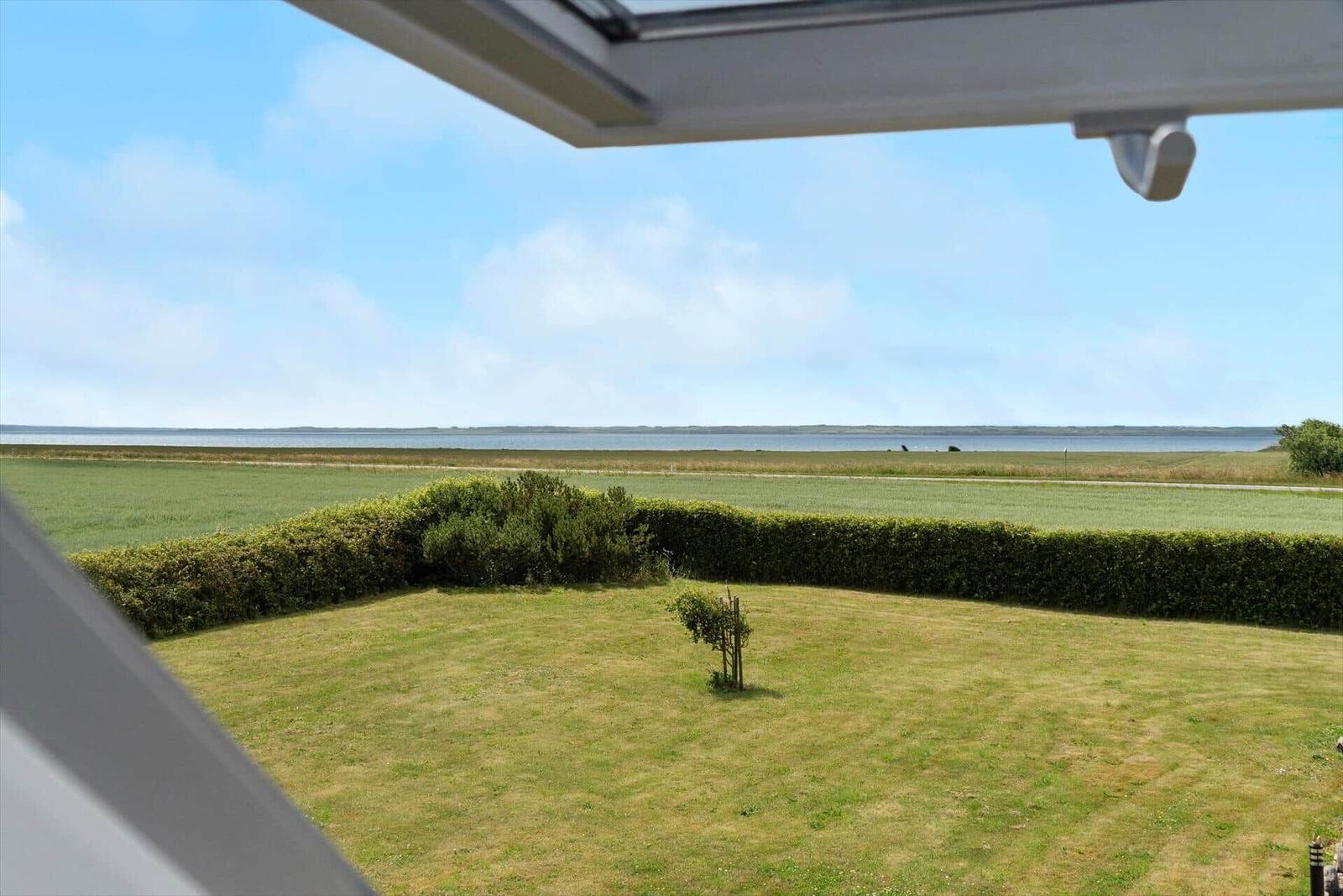 From the window, you see a lawn and a river.