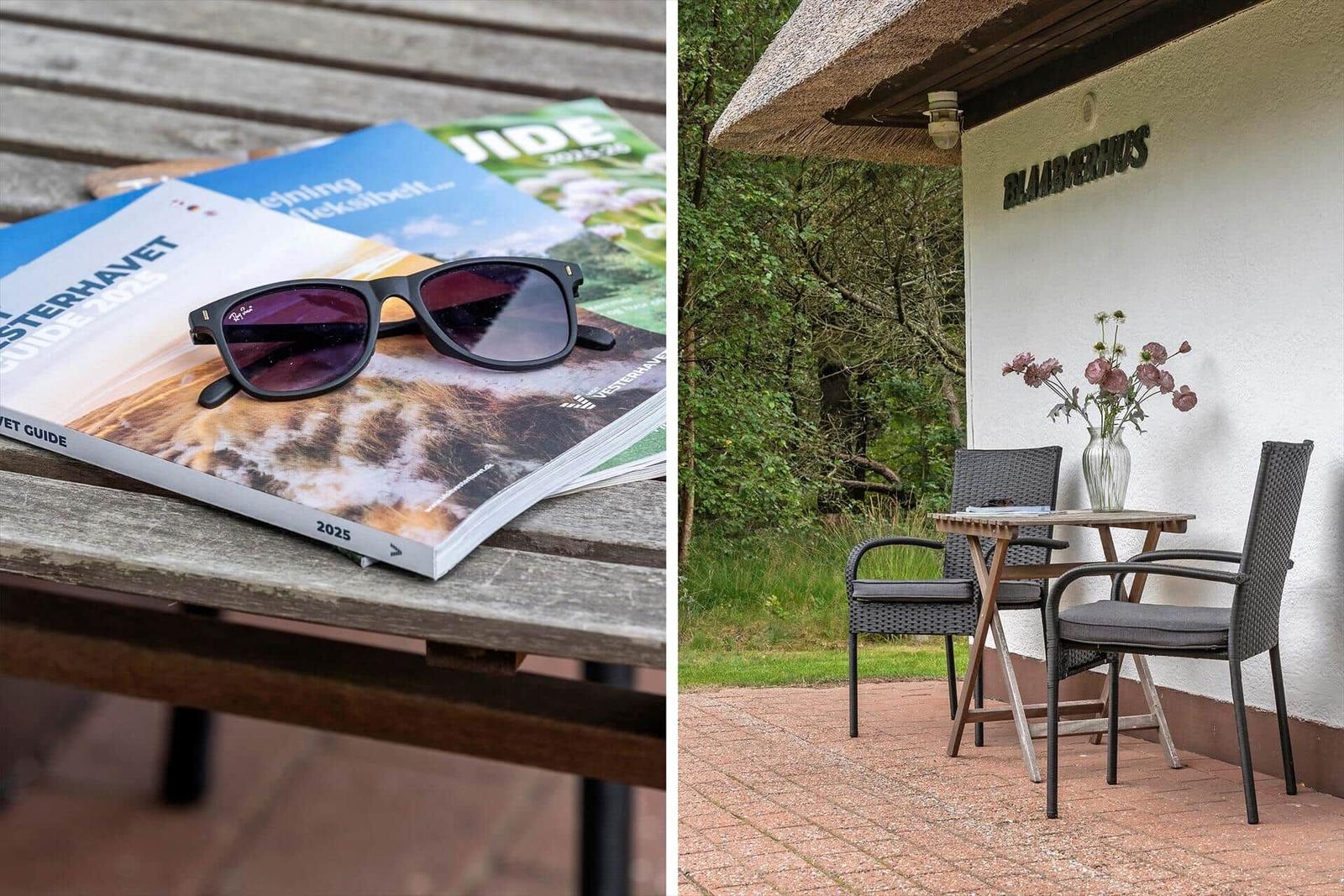 Tisch mit Reiseführern und Sonnenbrille. Außenbereich mit Tisch, Stühlen und Blumen.