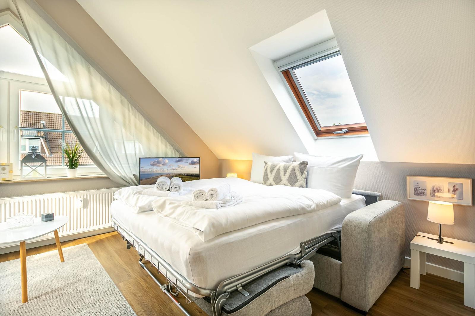 Wohnzimmer mit Schlafsofa...