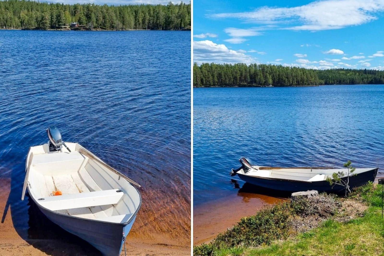 Ein weißes Boot liegt am Ufer eines blauen Sees. Im Hintergrund sind Bäume zu sehen.