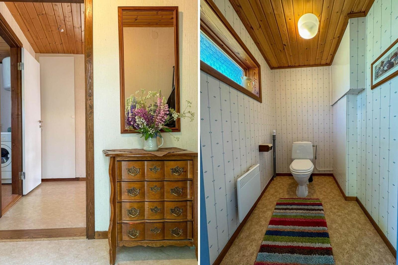 Flur mit Schrank und Spiegel. Badezimmer mit Toilette und Fenster.