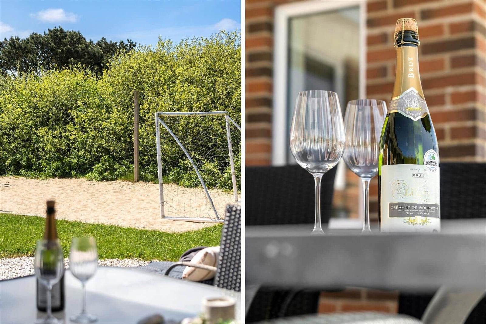Outdoor area with table, glasses, and a soccer goal in the background.