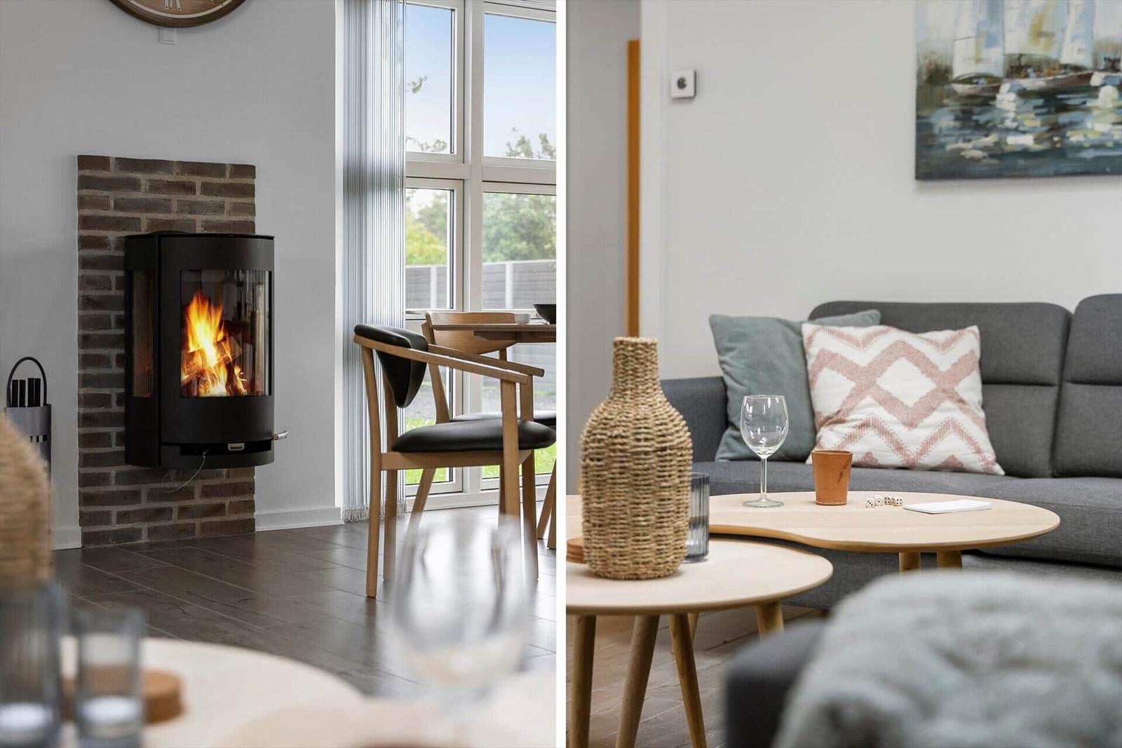 Fireplace with burning wood, seating with cushions and table