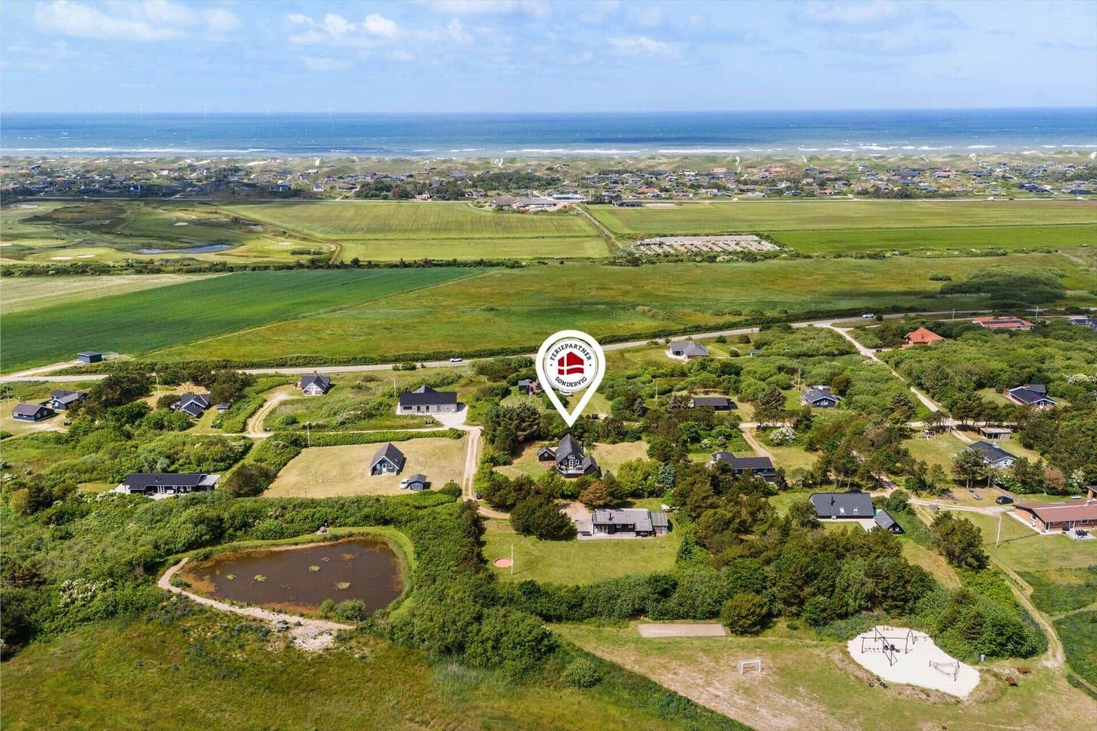 Rural holiday home with sea view and green meadows.