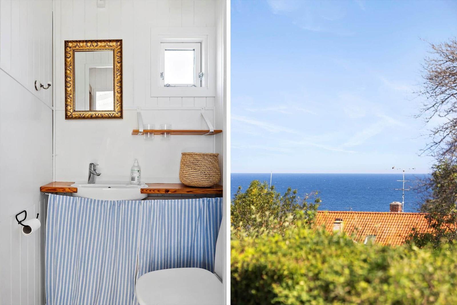 Bathroom with sink and view of the sea.
