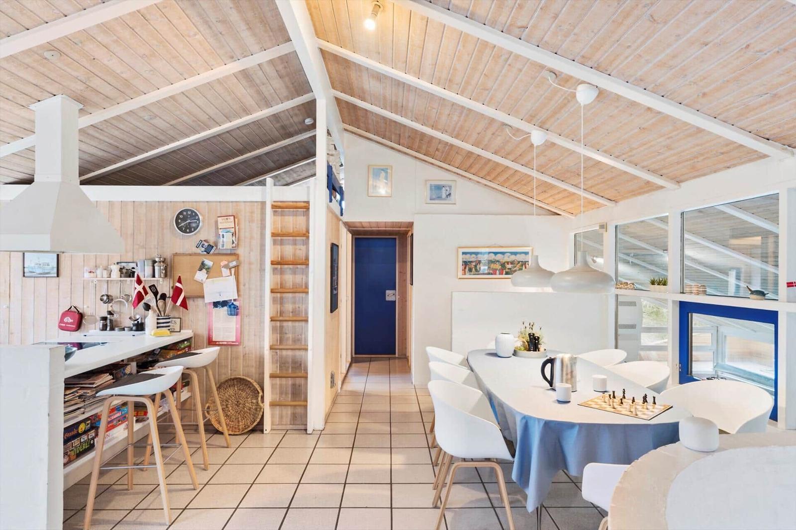 Kitchen with dining area and bedroom under roof