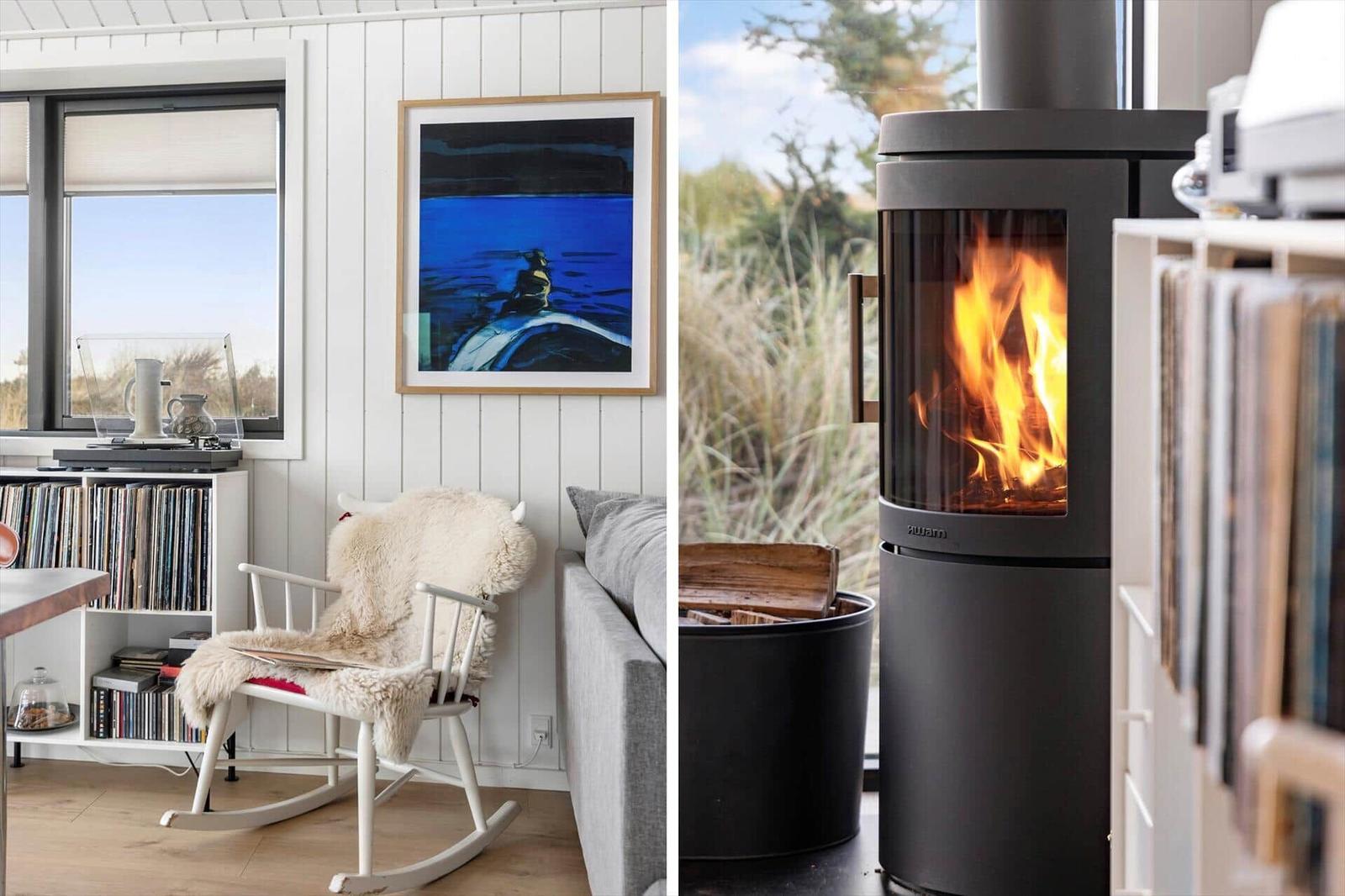 Living room with rocking chair, fireplace, and grass view.