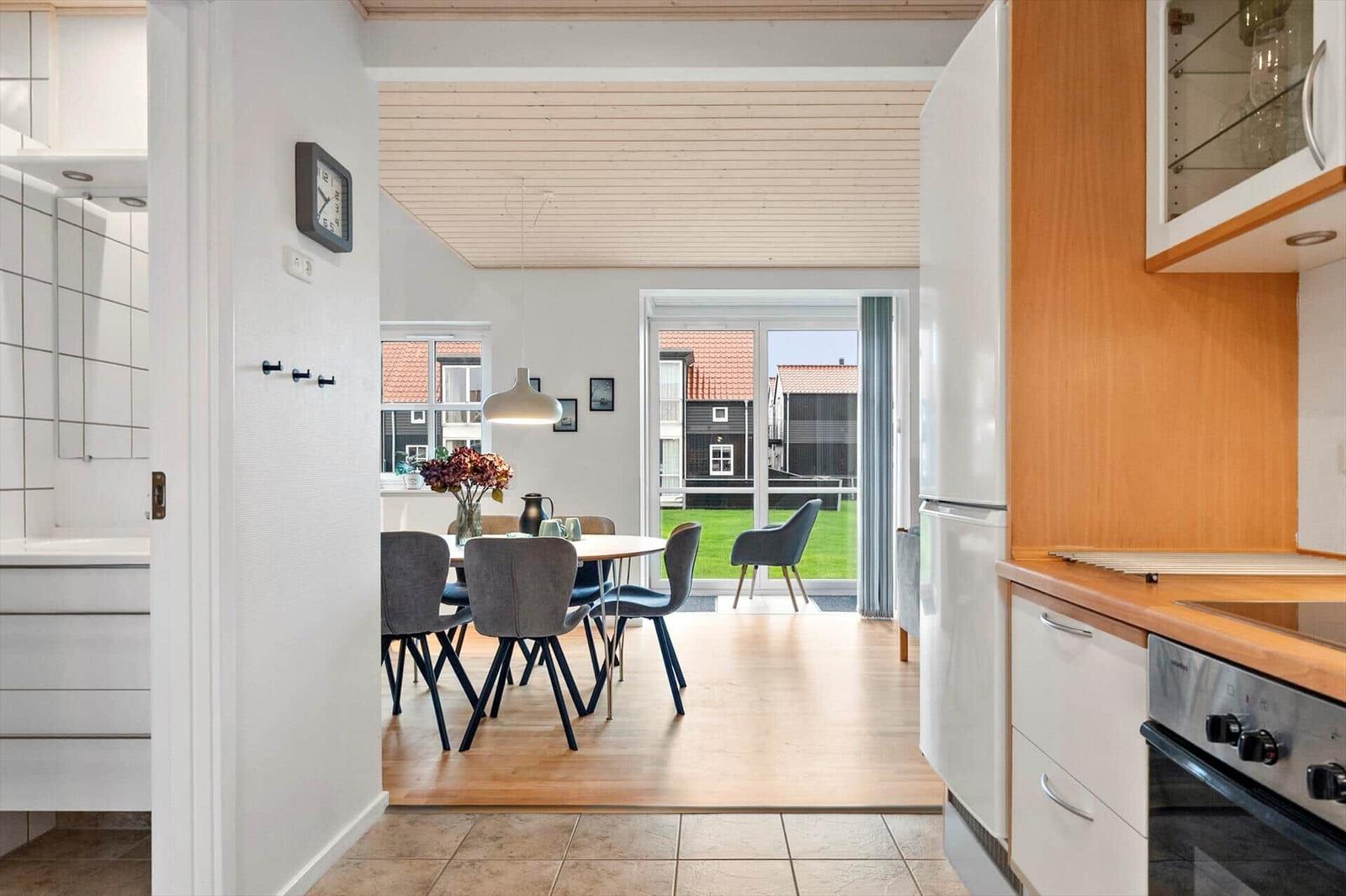 Kitchen with dining area and view of garden.