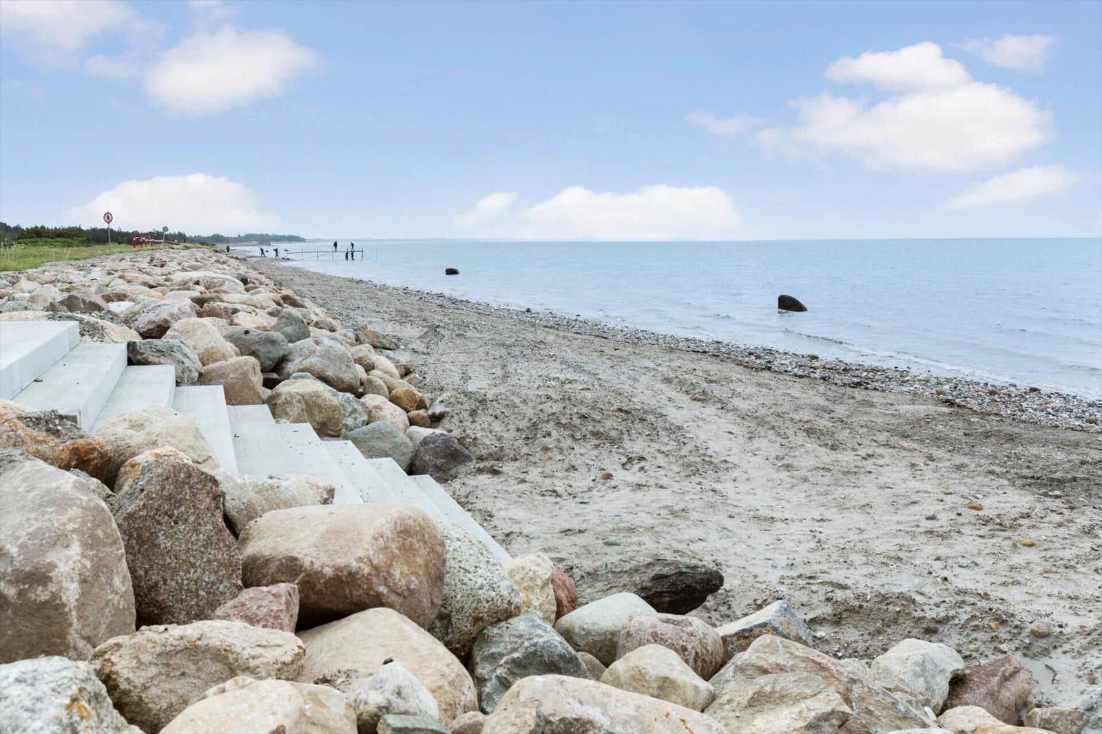 Rocky beach with steps and view of the sea