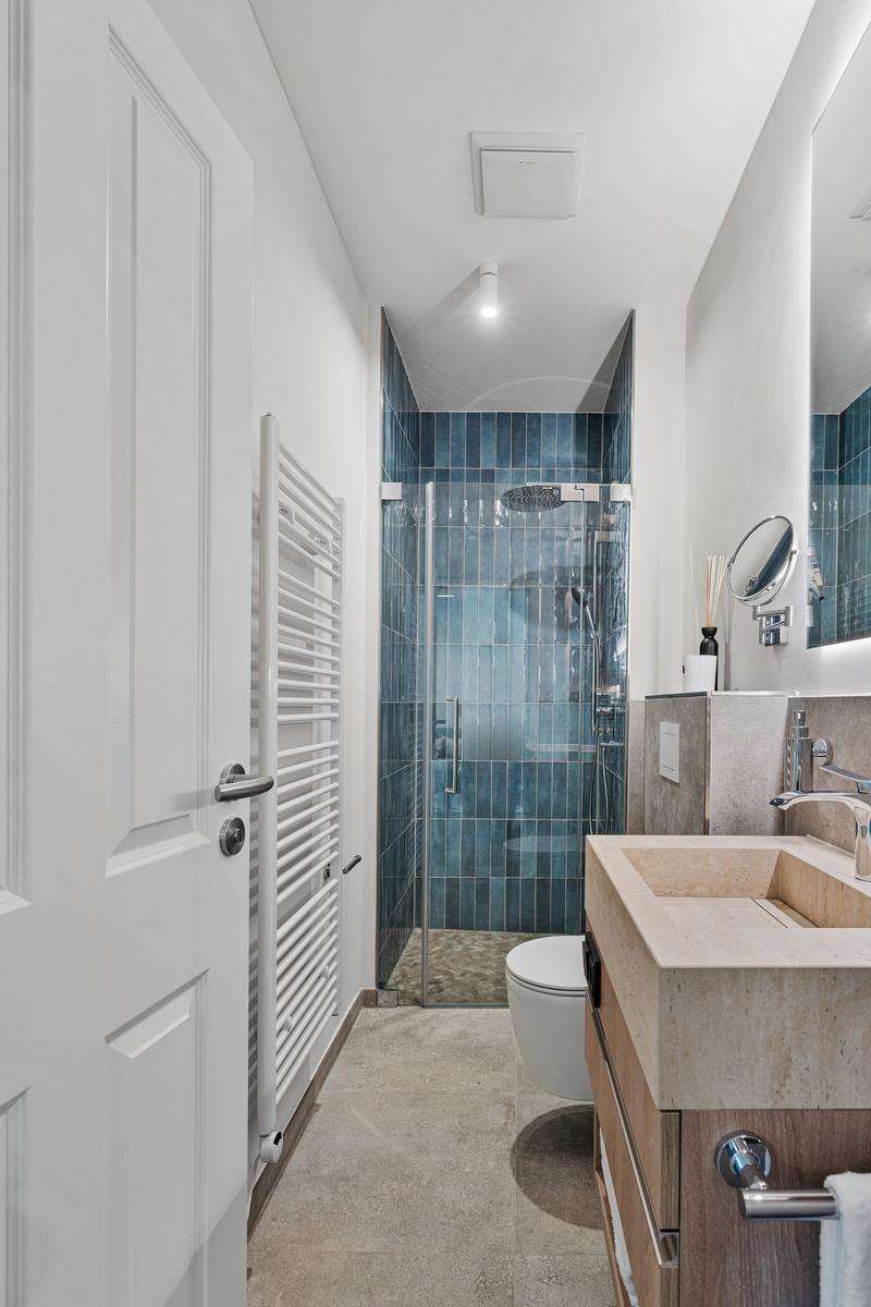 Bathroom with shower, sink, and toilet