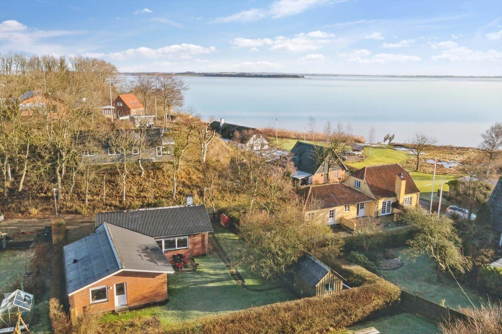 House with garden and view of a lake.