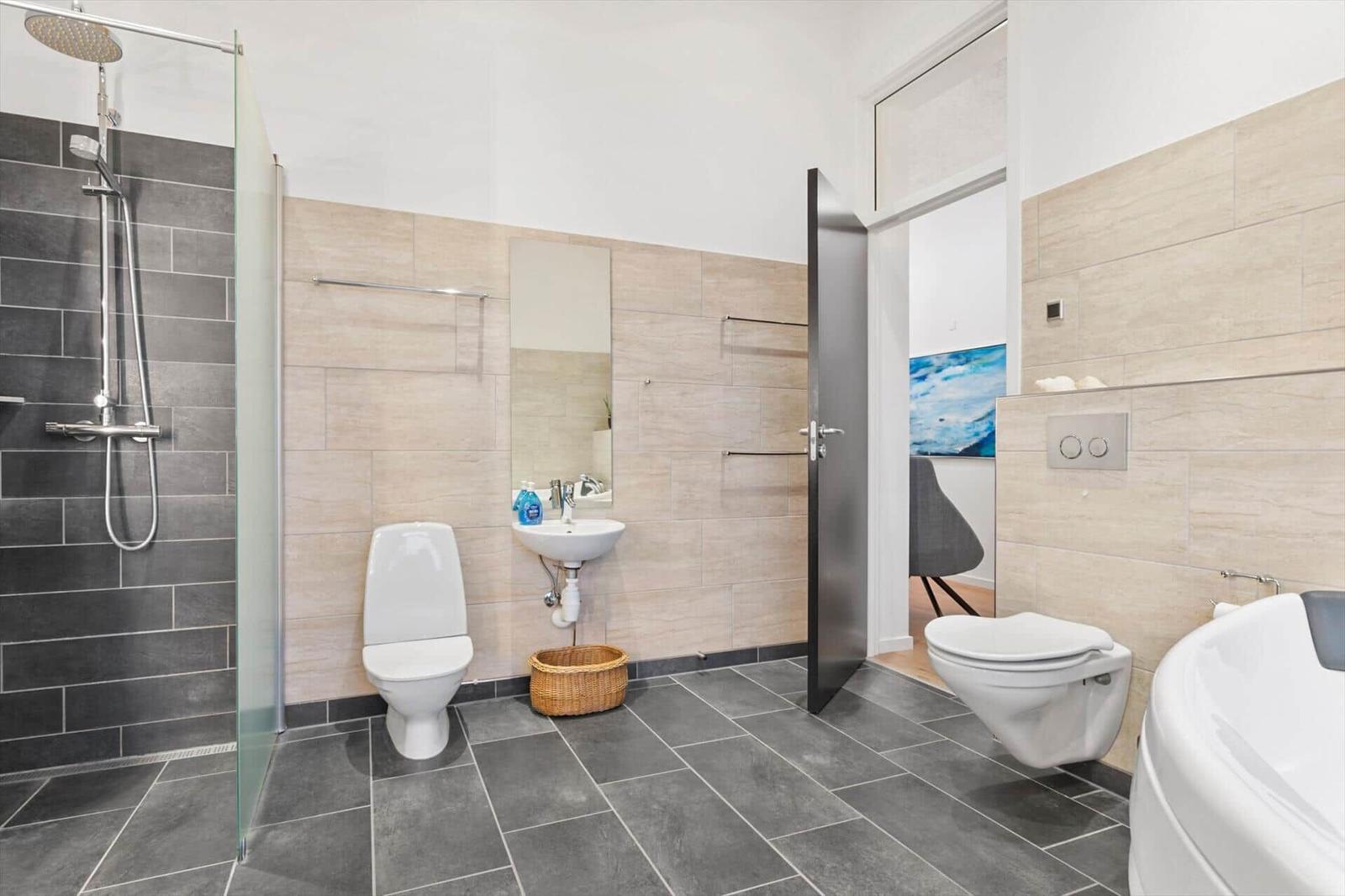 Bathroom with shower, toilet, sink, and bathtub.