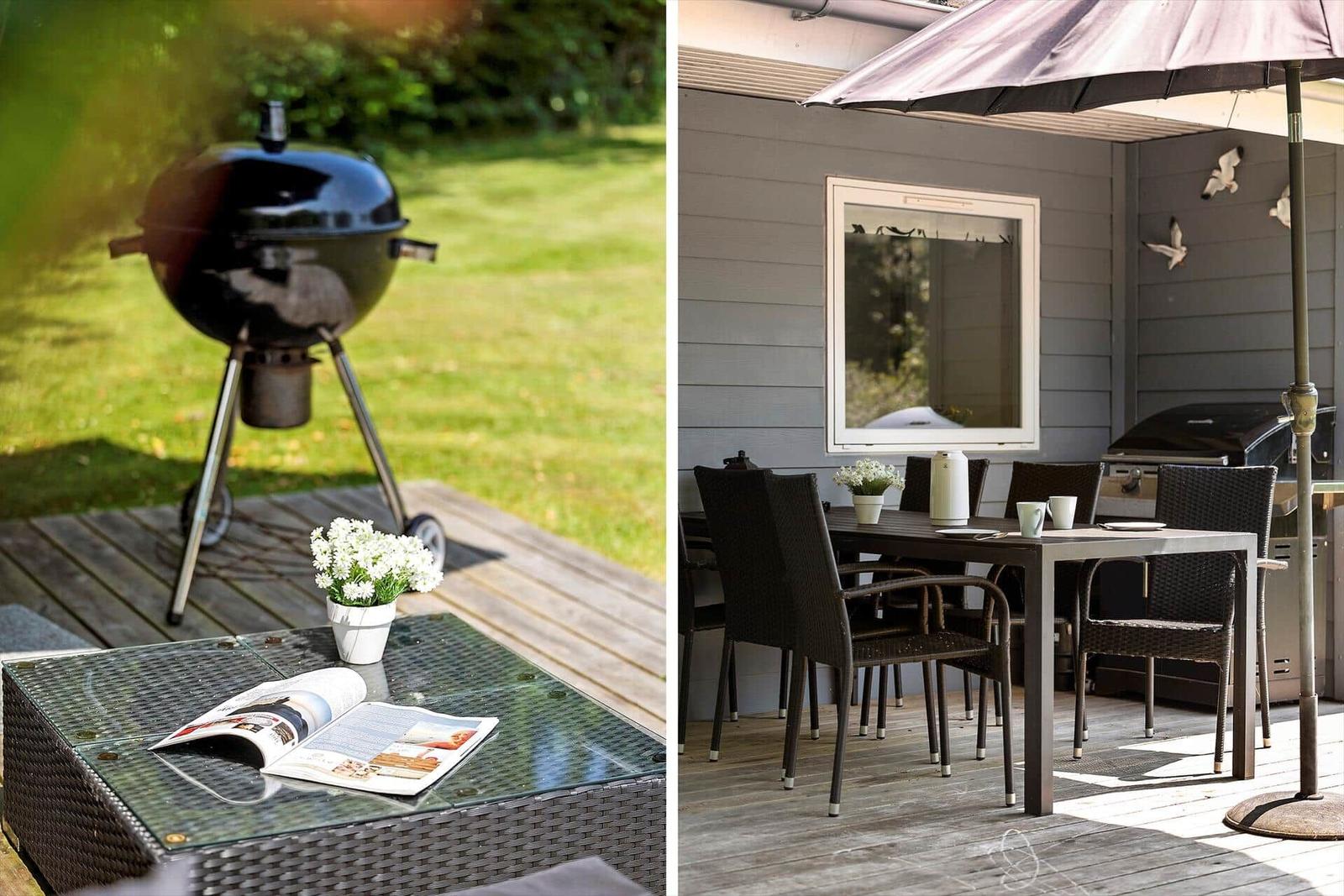 Deck with grill, table, chairs, and umbrella. Green lawn in background.