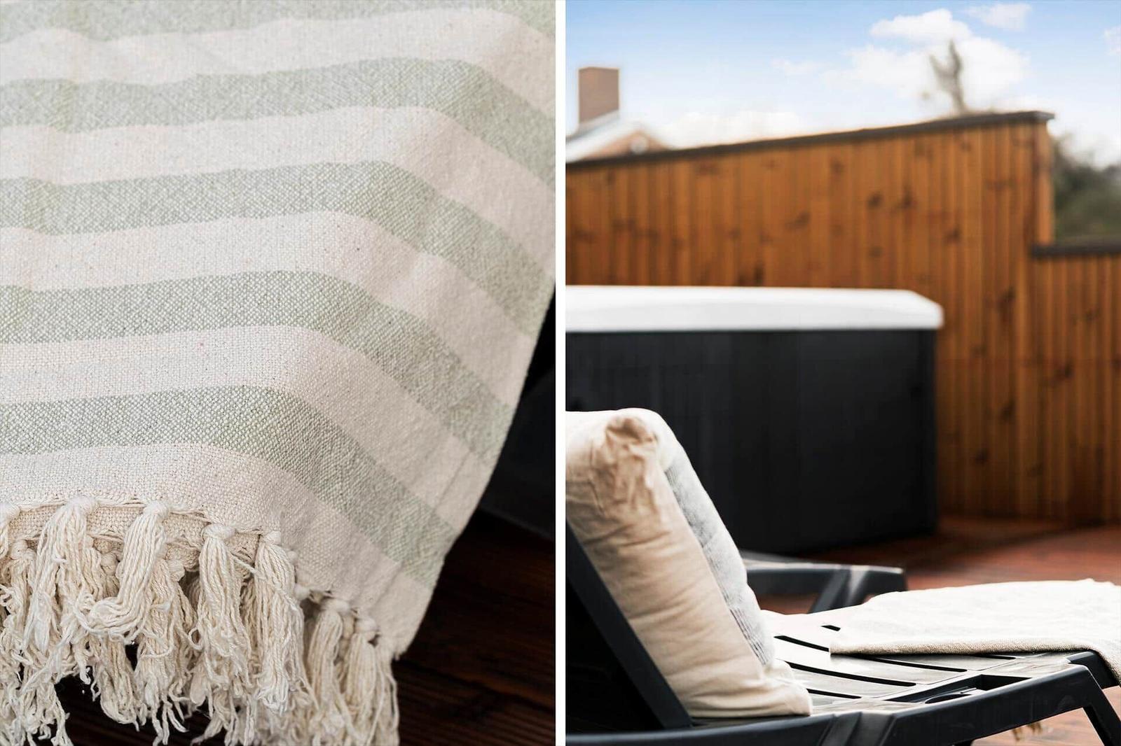 Strickdecke mit Fransen und Außenterrasse mit Liegestuhl und Whirlpool.