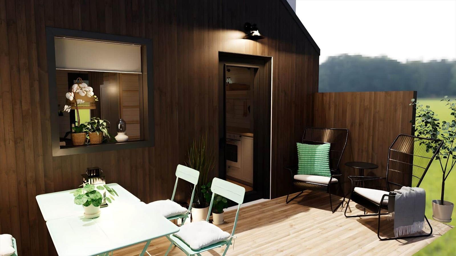 Terrace with table, chairs, and loungers. Background: wooden wall and view of field.