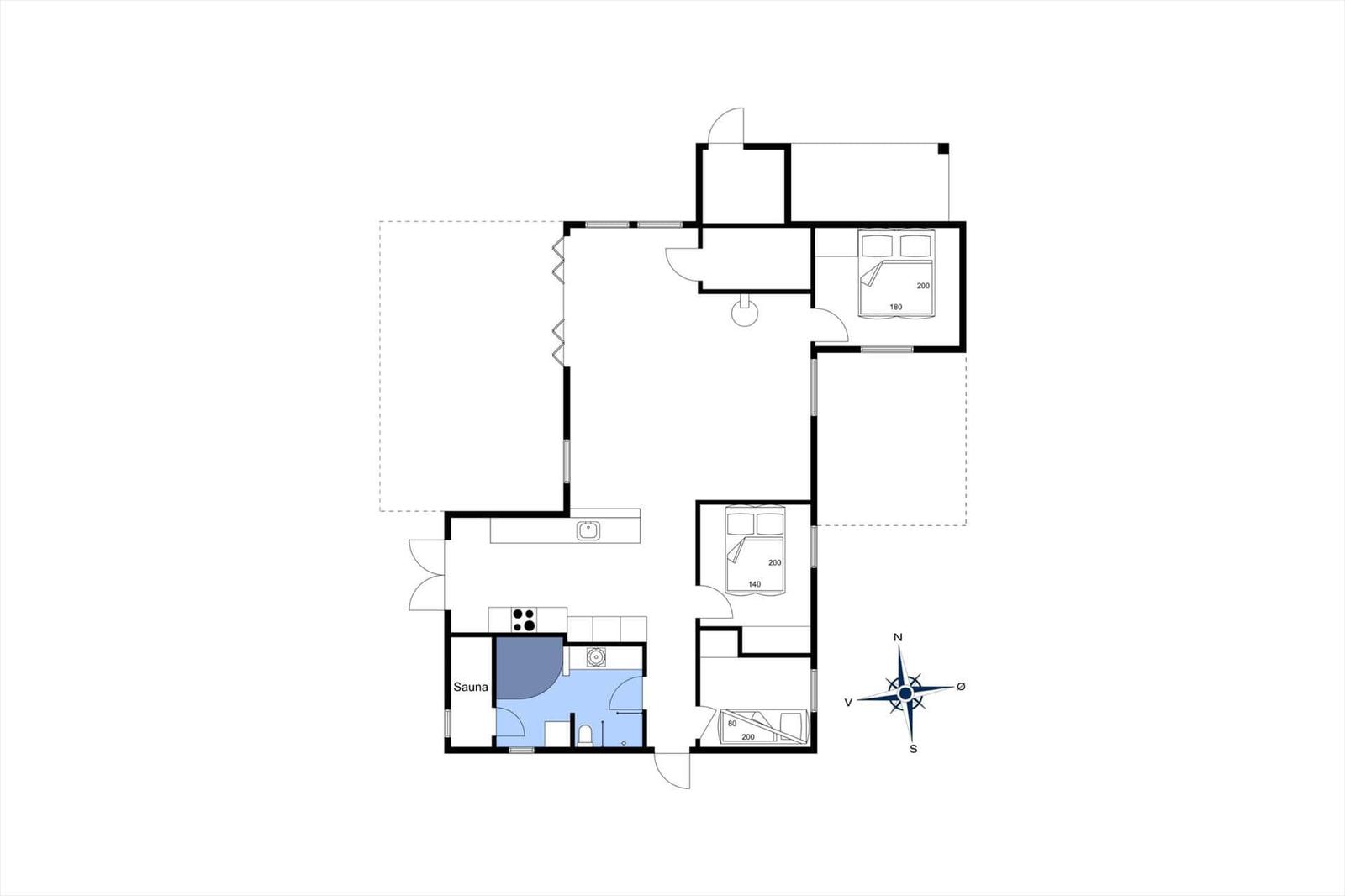 This apartment has a sauna, kitchen, and three bedrooms with beds.